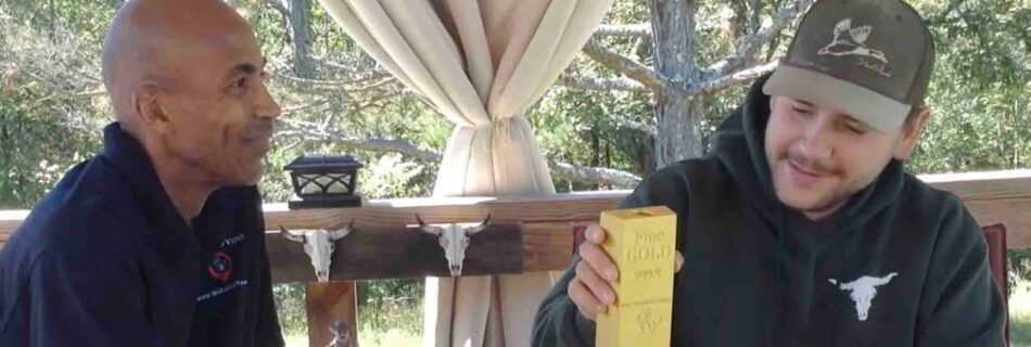 Garrett holding a check from a forgotten investment account located by WeFoundYou